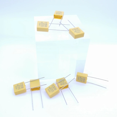 Сопротивляющийся и емкостный цвет конденсатора 0.1UF 310V P7.5MM сброса давления желтый